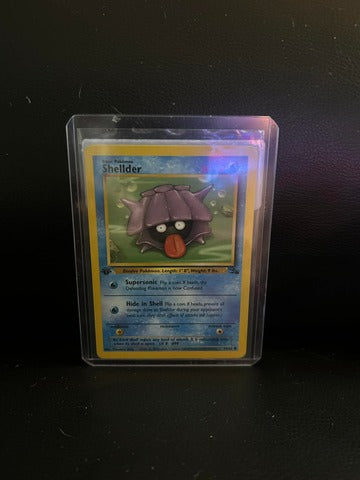 Shellder 54/62 Fossil Common Pokemon 1st Edition Moderately Played English Trading Card