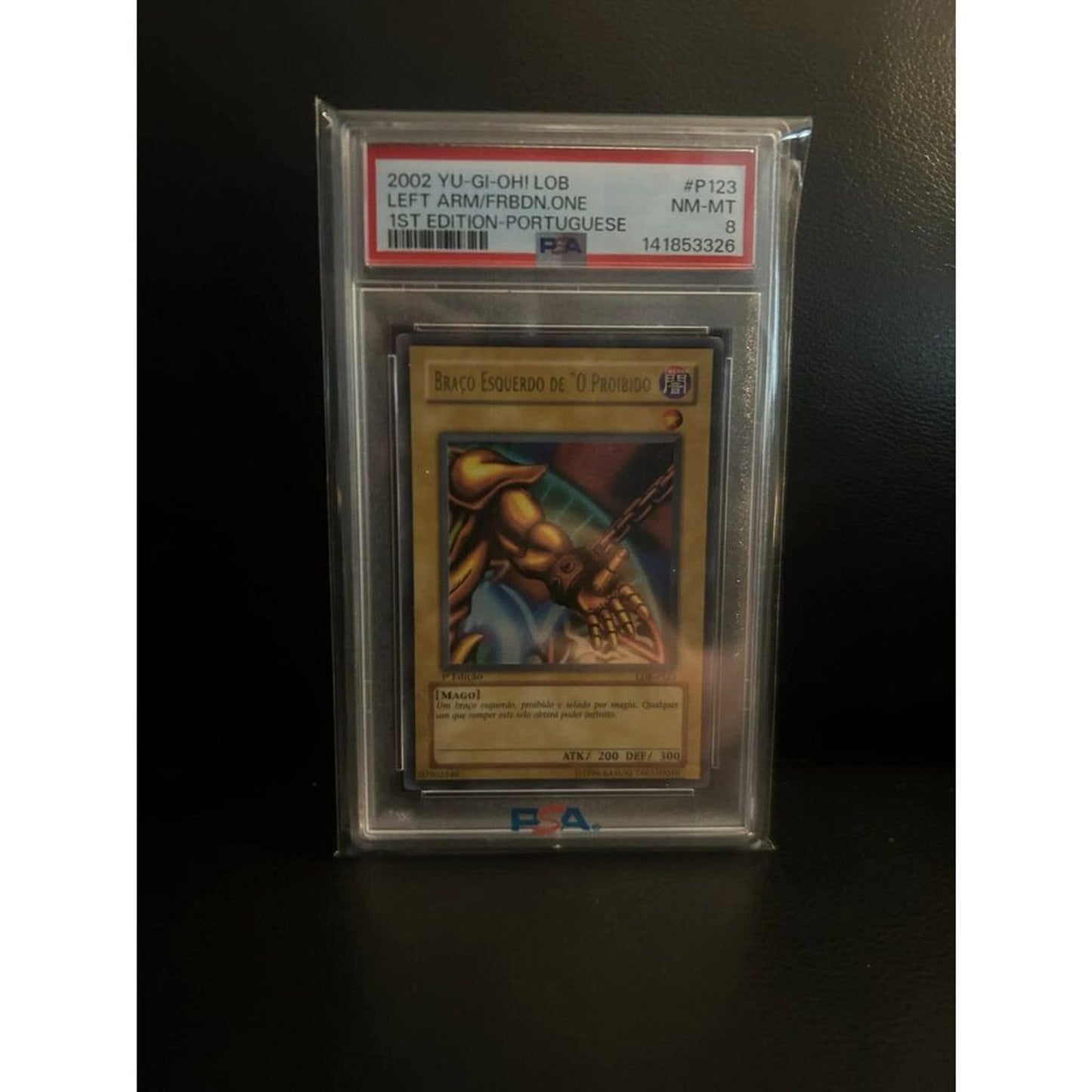 Left Arm of the Forbidden One LOB-123 1st Ed Yu-Gi-Oh! Graded PSA 8 Portuguese Trading Card