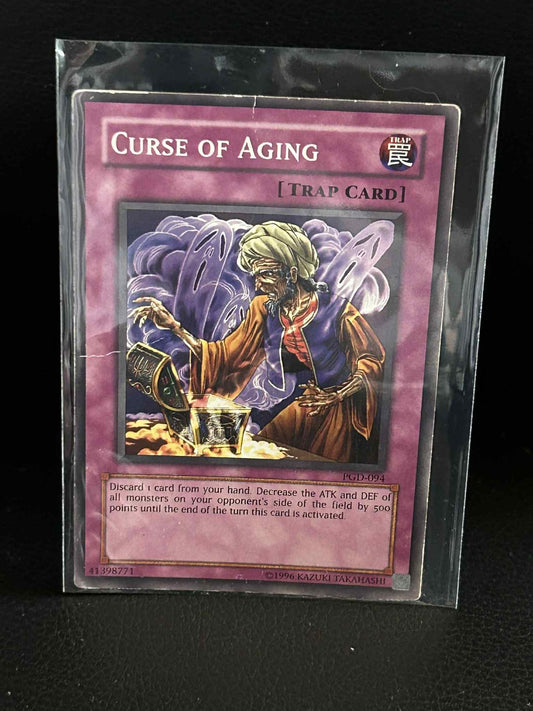 Curse of Aging - PGD-094 - Common - Unlimited Edition Pharaonic Guardian Yu-Gi-O