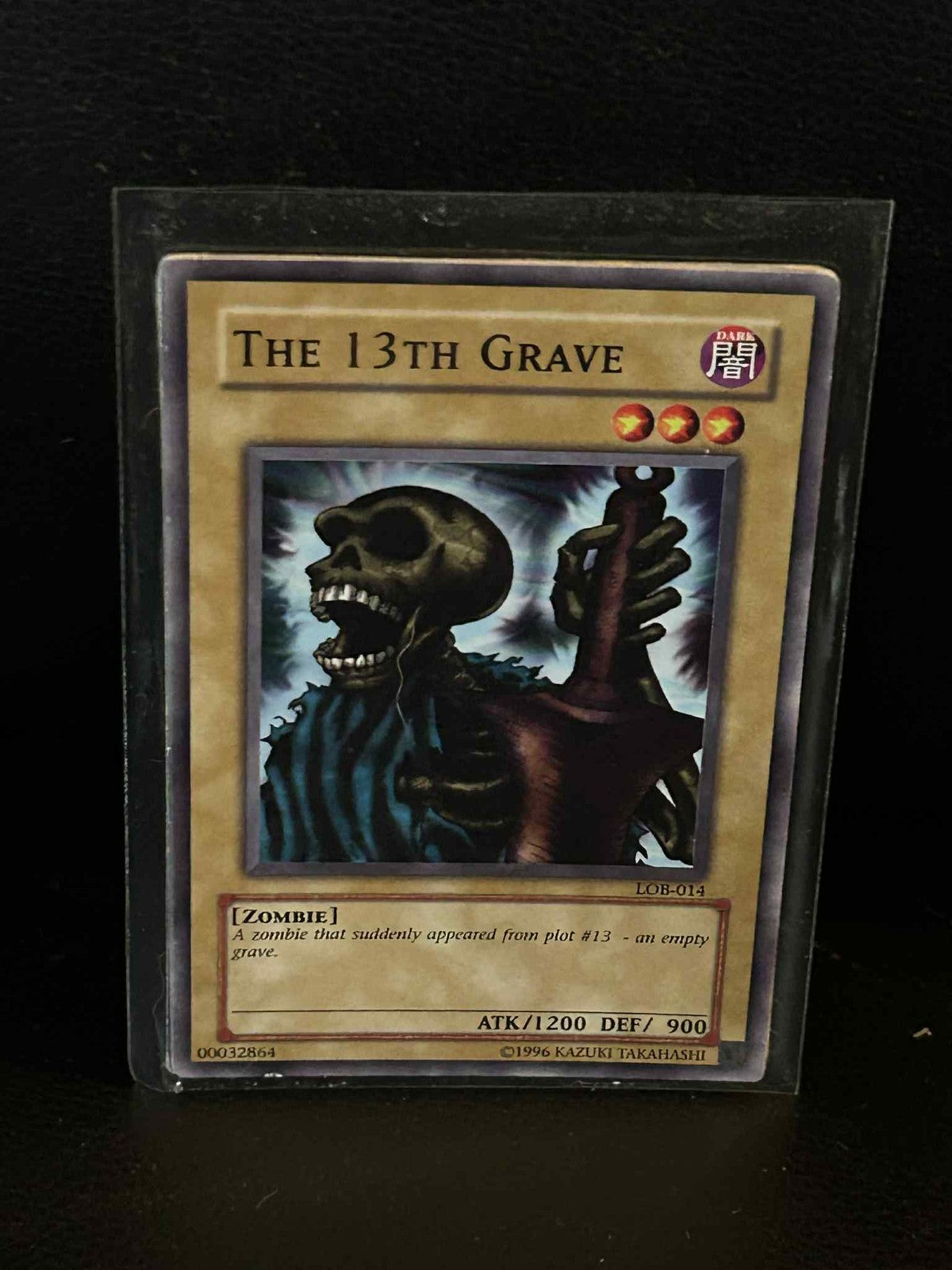 The 13th Grave - LOB-014 - Common - Unlimited Edition Legend of Blue Eyes White